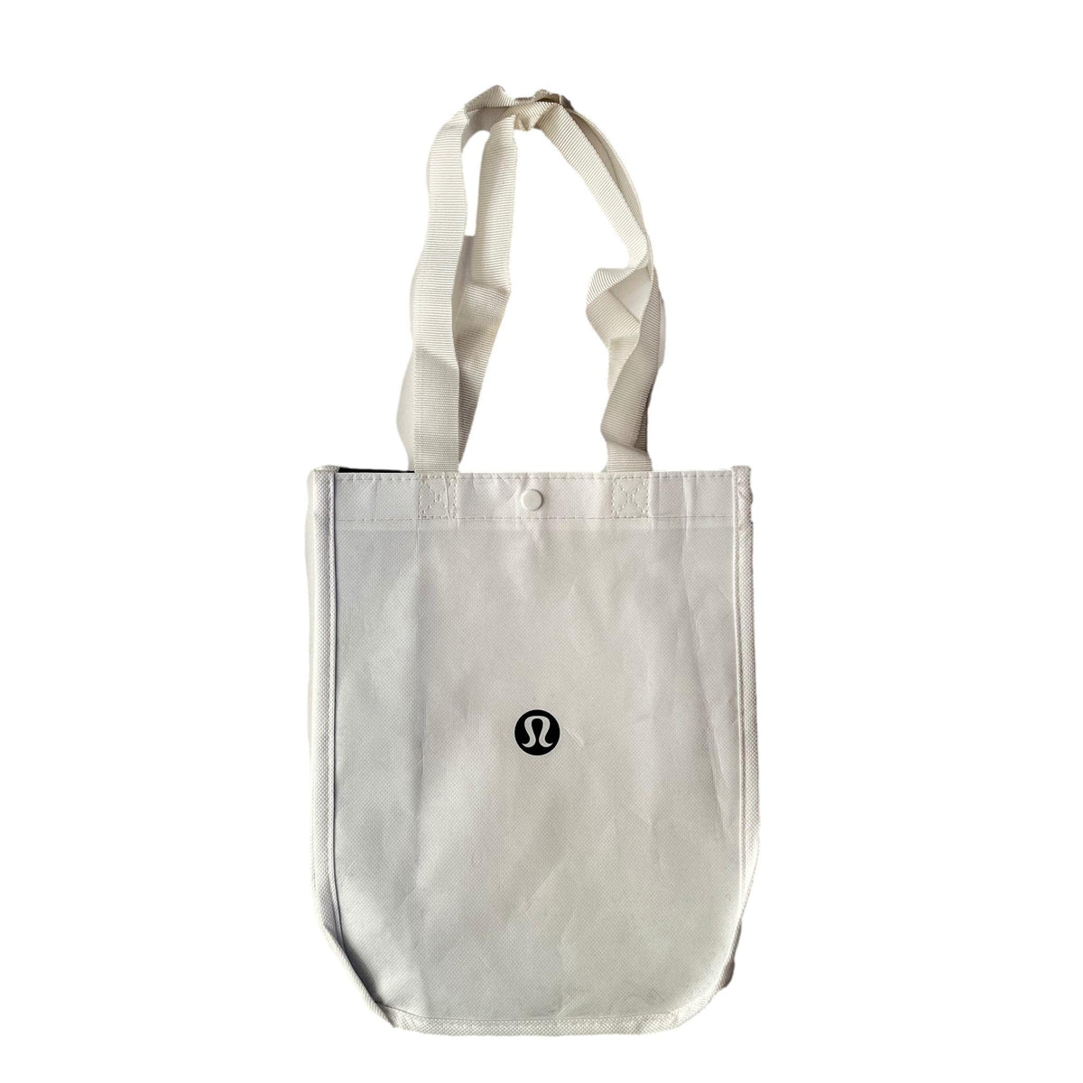 Lululemon new white gym tote bag front view, lightweight and reusable for lunch or gym gear.