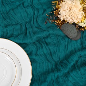 Lumaycens teal table runner elegantly draped for a chic setup.