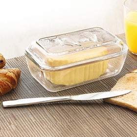 Luminarc cow butter dish rests on a bright kitchen counter.