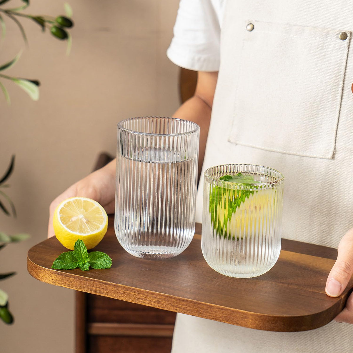 Lumkit glassware with elegant ribbed pattern enhances table presentation.