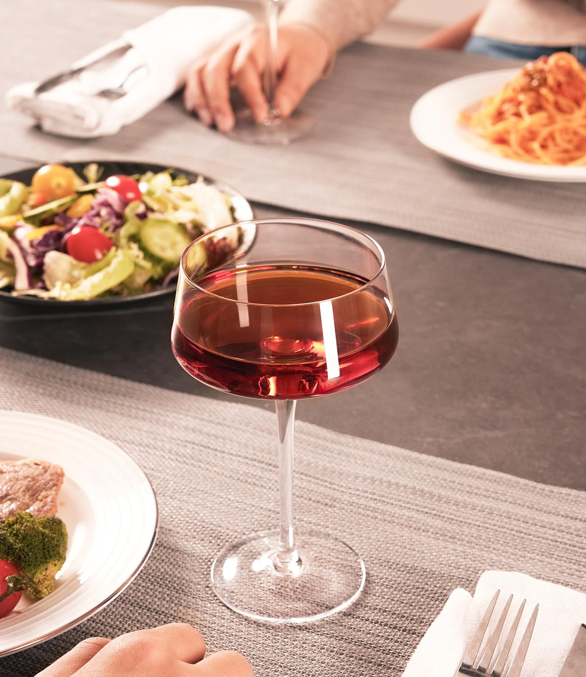 Luna & Mantha dishwasher-safe coupe glasses simplify cleanup after dinner parties.