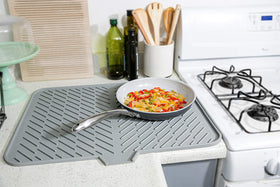 Luxet multiuse mat doubles as a heat-safe trivet for countertops.