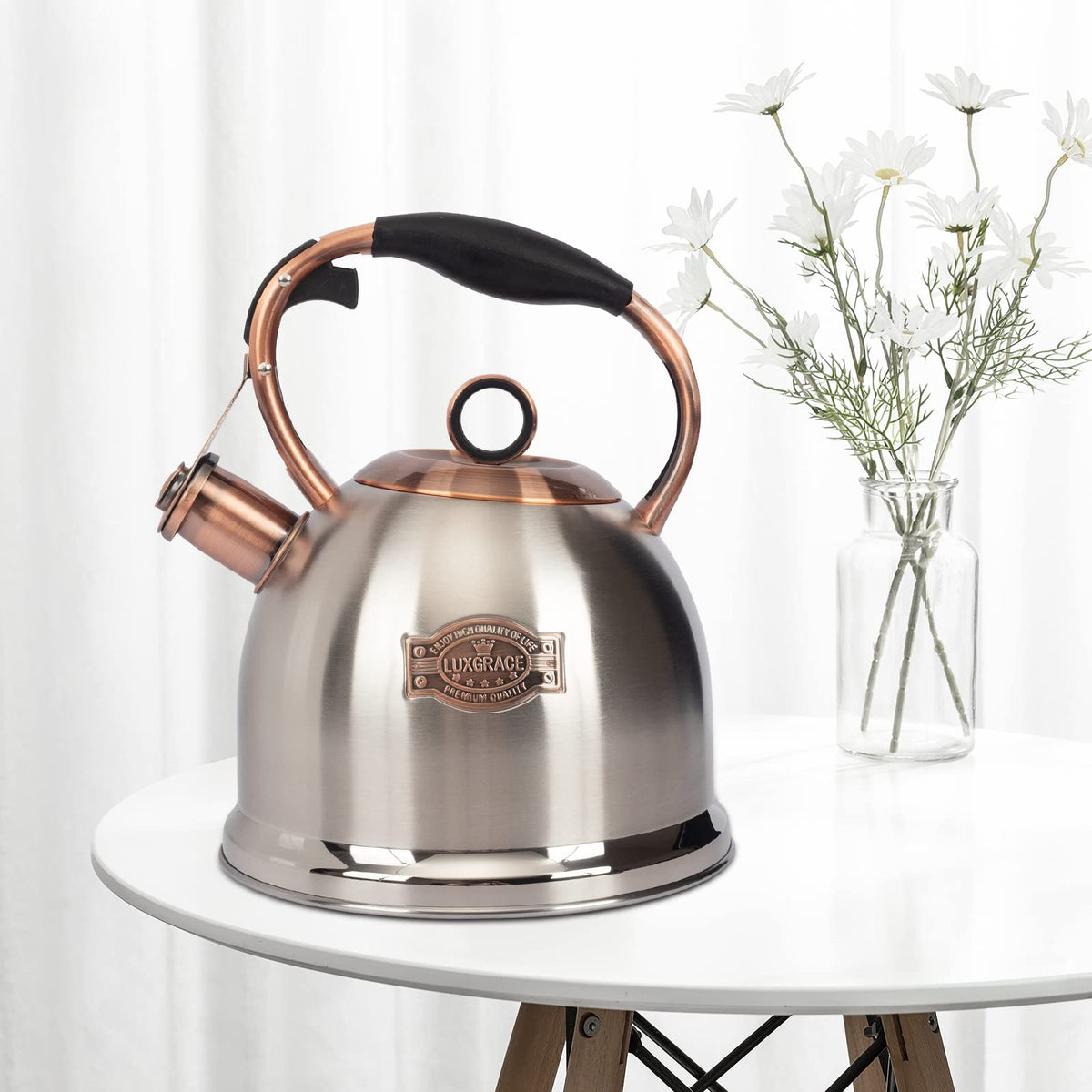 LUXGRACE induction-compatible kettle bottom with five-layer design for uniform heat.