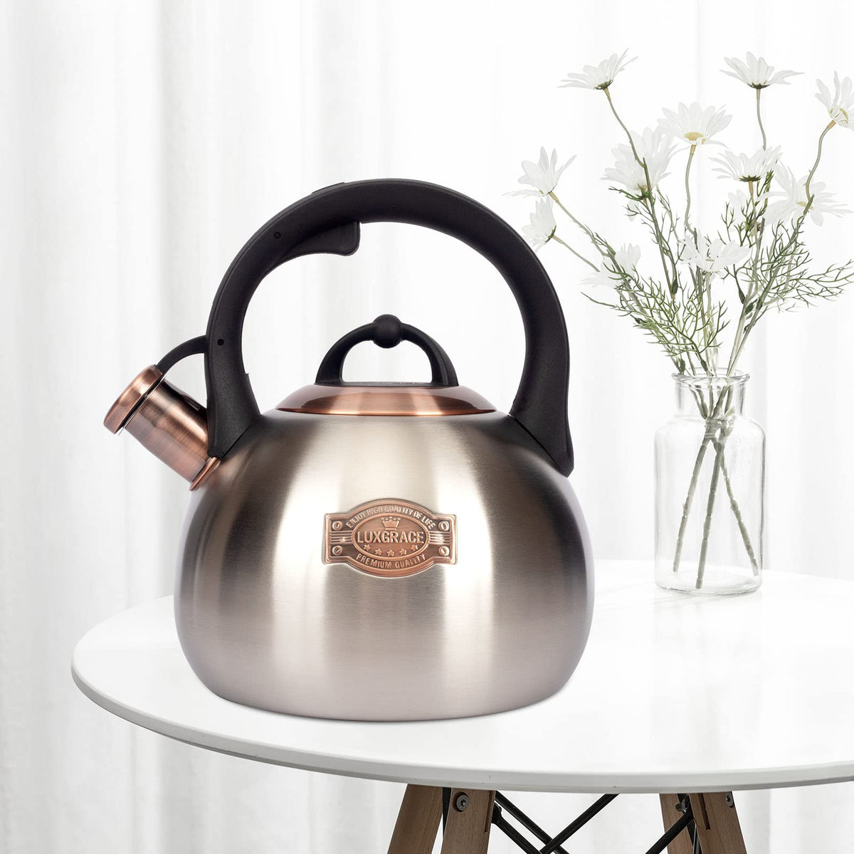 LUXGRACE tea kettle handle highlights ergonomic grip for easy one-handed pouring.