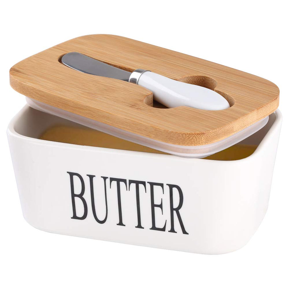 Lxmons ceramic butter dish with wooden lid keeps butter fresh on the counter.