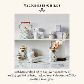 Mackenzie-Childs brand story enamelware packaging evokes craft heritage.