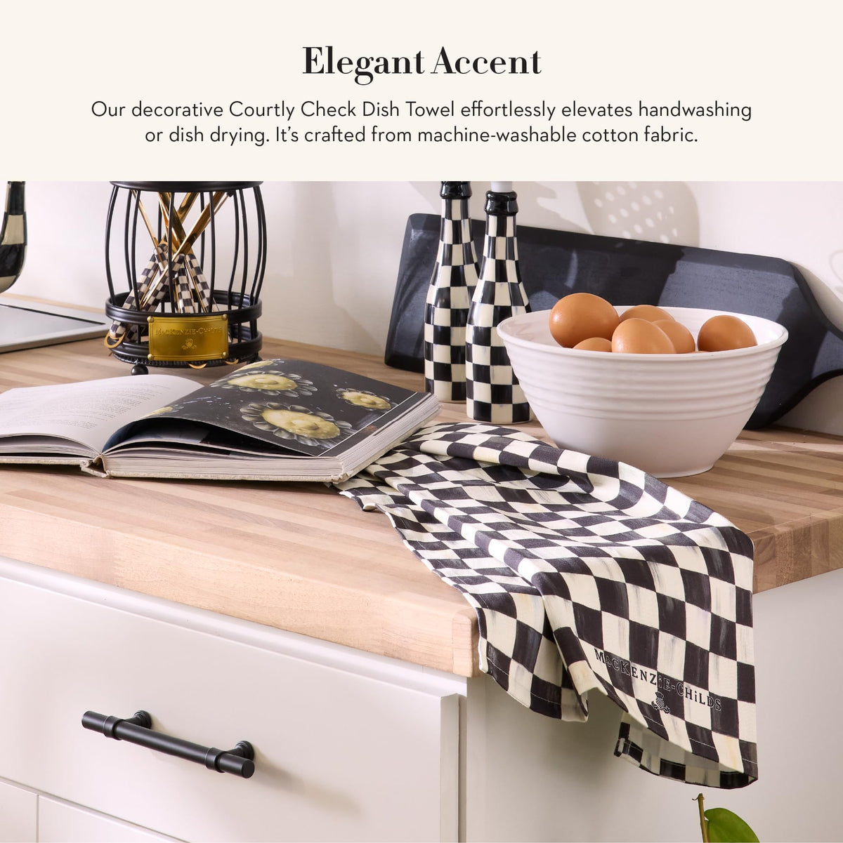 Mackenzie-Childs Courtly Check cotton towel adds decorative warmth to hands and dishes.
