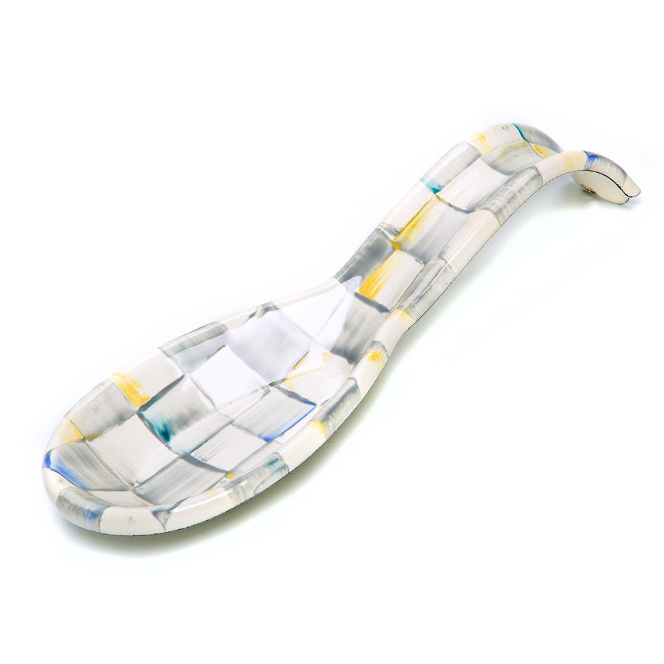 MACKENZIE-CHILDS enamel spoon rest on stovetop with grey Sterling Check; neat and stylish.