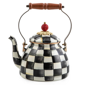 MACKENZIE-CHILDS enamel tea kettle Courtly Check base on stove, stylish focal point.