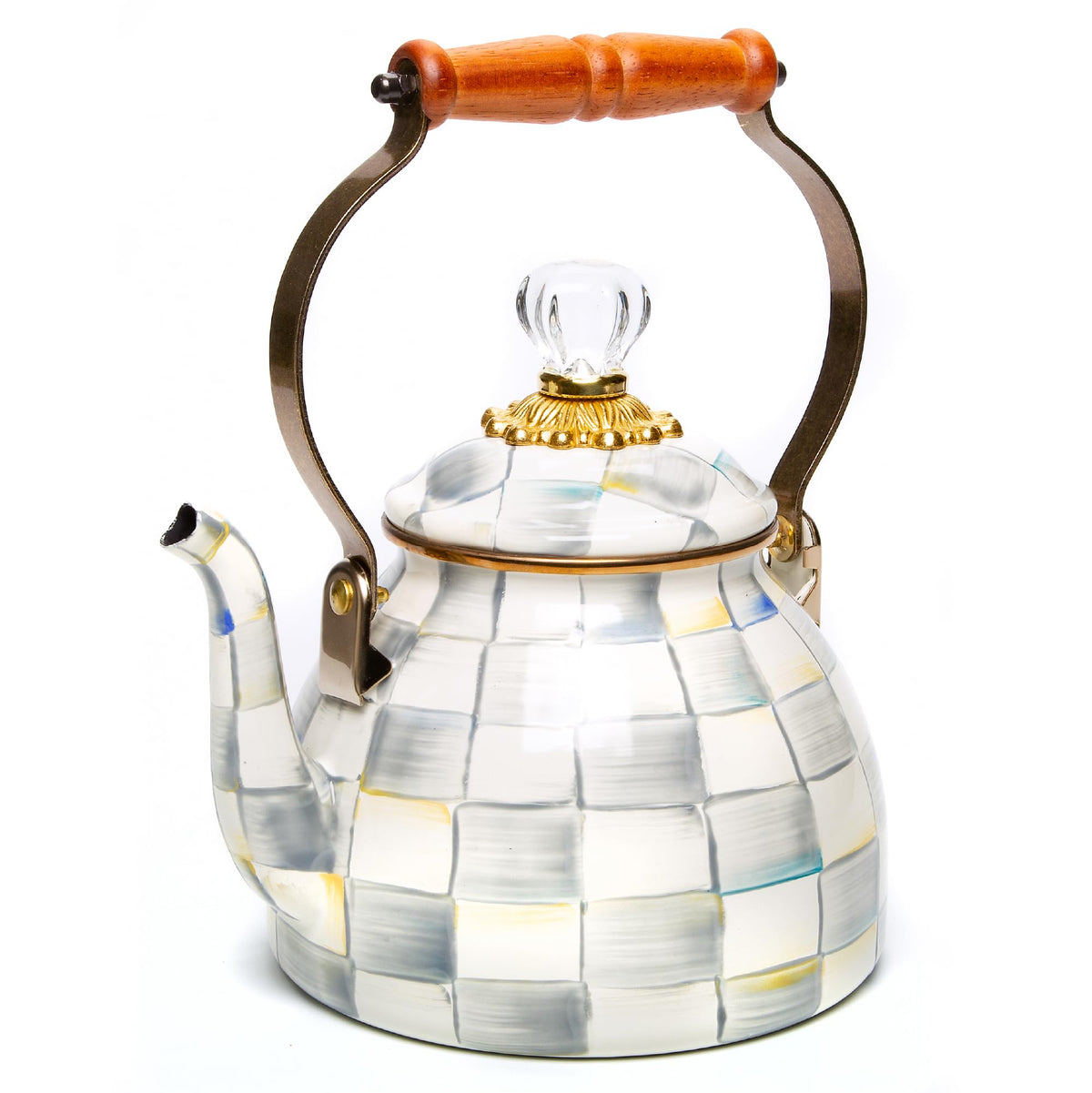 Mackenzie-Childs enamel tea kettle with wood handle on stovetop, durable heat-ready daily use.