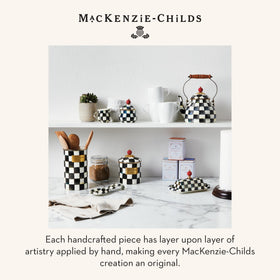 Full display of MacKenzie-Childs enamel utensil holder on counter