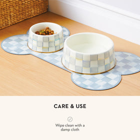 Indoor-outdoor Mackenzie-Childs Pup Placemat fits floors and patio spaces