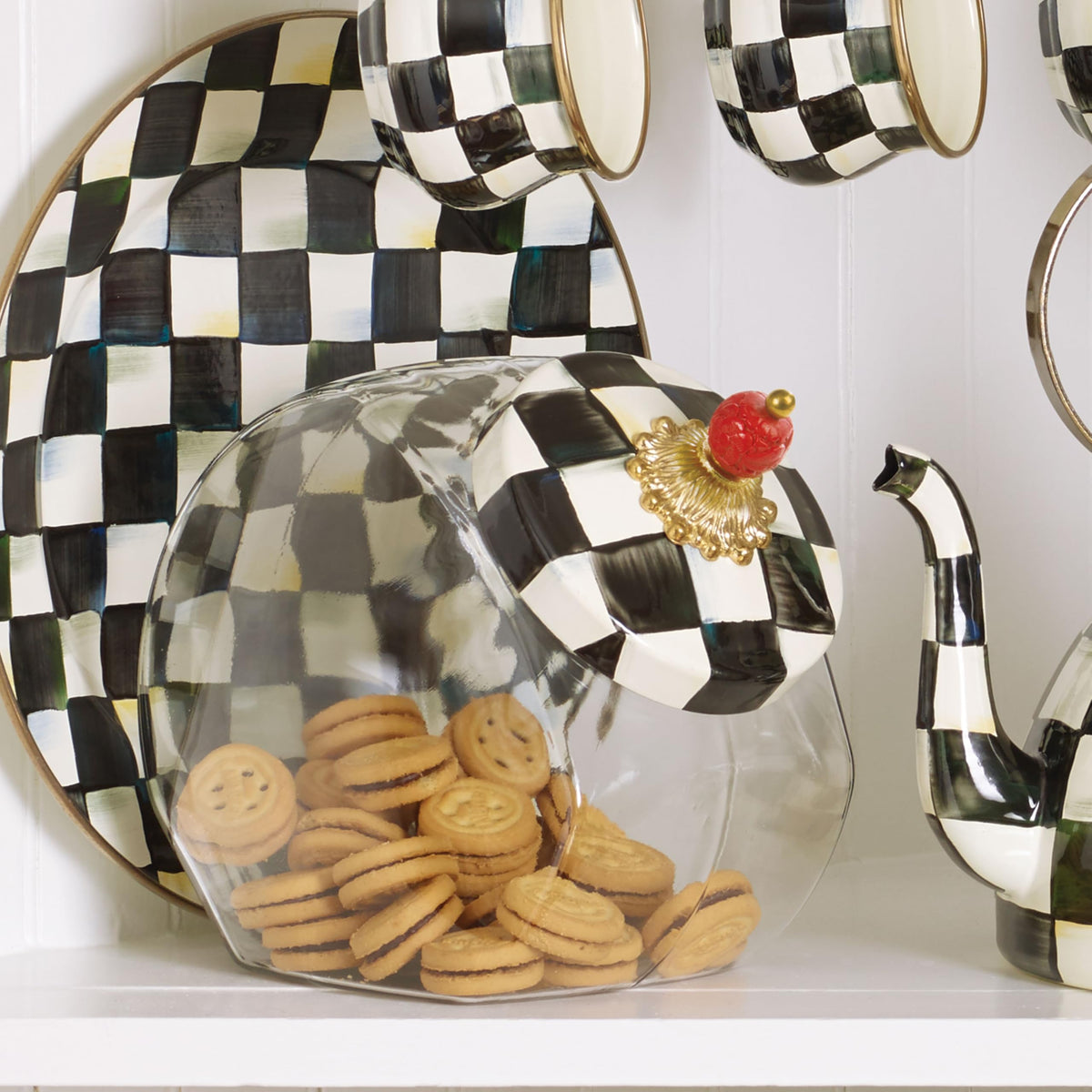 MacKenzie-Childs cookie jar with Courtly Check elevates everyday storage into a decorative centerpiece.