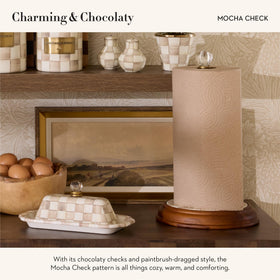 MacKenzie-Childs mocha-check enamel detail elevates kitchen decor with pattern charm.