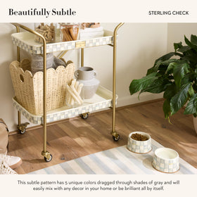 Pet bowls on Mackenzie-Childs Pup Placemat keep feeding area tidy and stylish