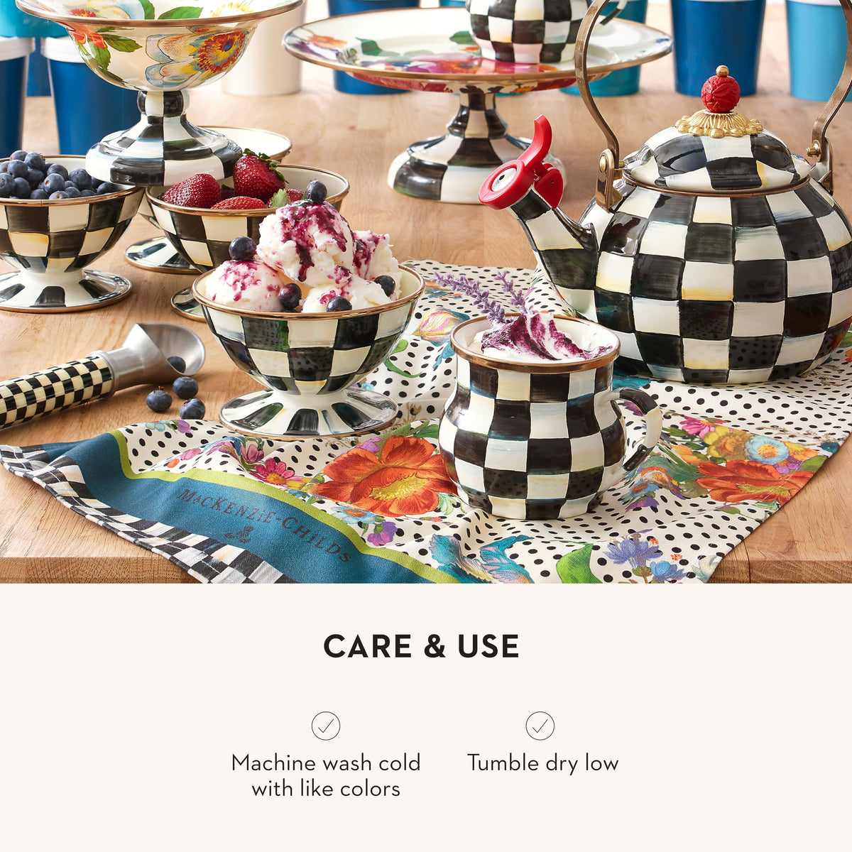 MACKENZIE-CHILDS dish towel against a black-and-white polka-dot backdrop.
