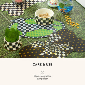 MACKENZIE-CHILDS Pup Placemat bowls neatly aligned.