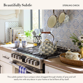 MacKenzie-Childs Sterling Check cutting board – two sizes for versatile kitchen tasks.