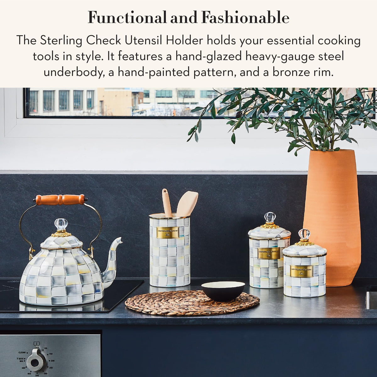 Mackenzie-Childs tall enamel utensil holder on countertop complements any kitchen decor.