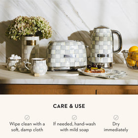 Mackenzie-Childs utensil holder on counter doubles as a stylish centerpiece.
