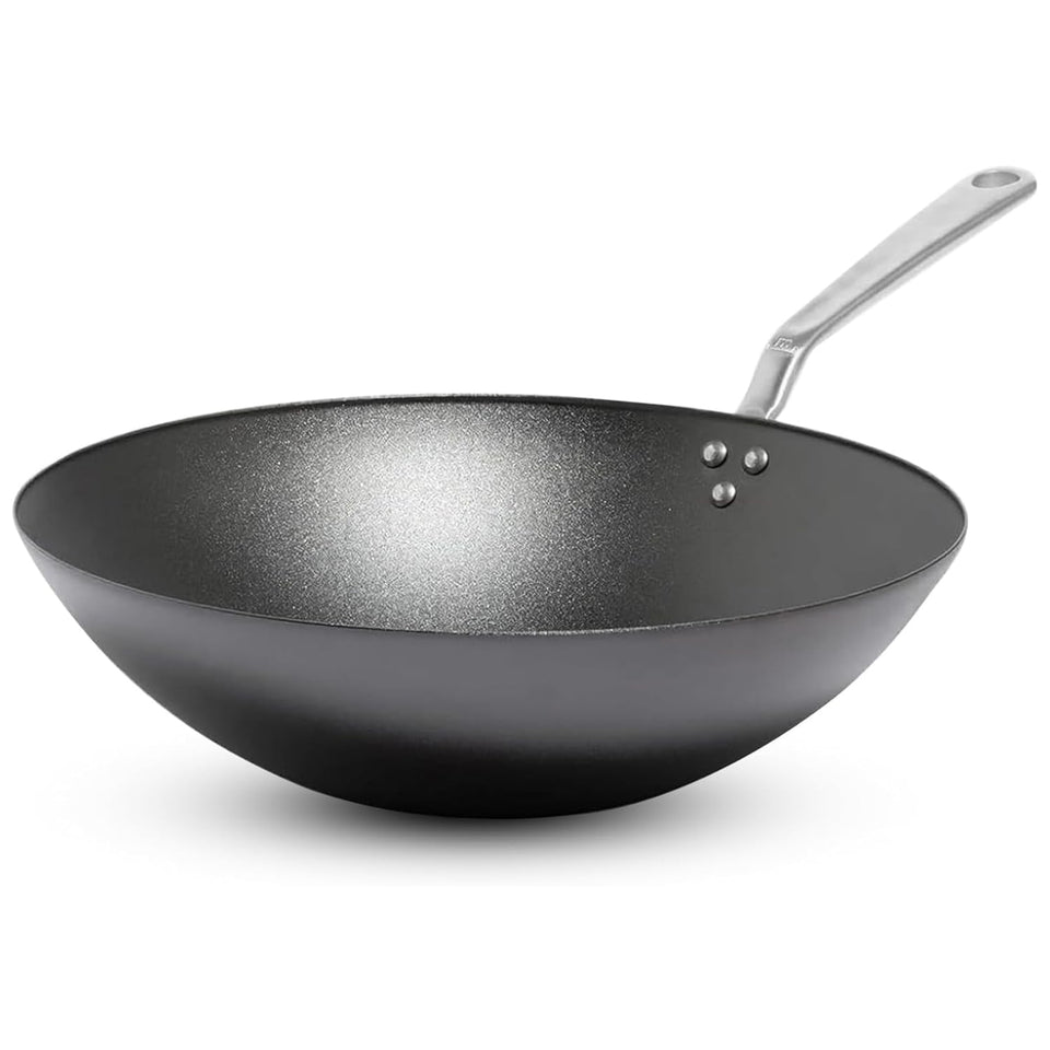 Made In 13-inch seasoned carbon steel wok top view for even searing.