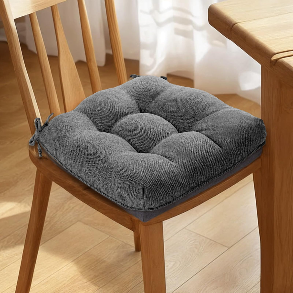 Magic Elephant cushions placed on a dining chair in a kitchen setup.