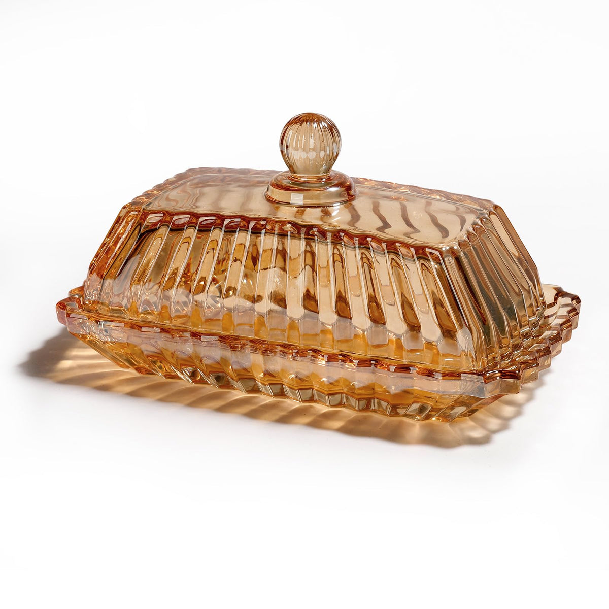 Mamalucky vintage glass butter dish with amber lid on the counter keeps butter fresh.