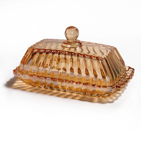 Mamalucky vintage glass butter dish with amber lid on the counter keeps butter fresh.
