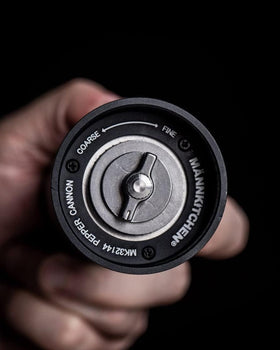 MANNKITCHEN Pepper Cannon base-cup provides handy storage and one-handed peppering.