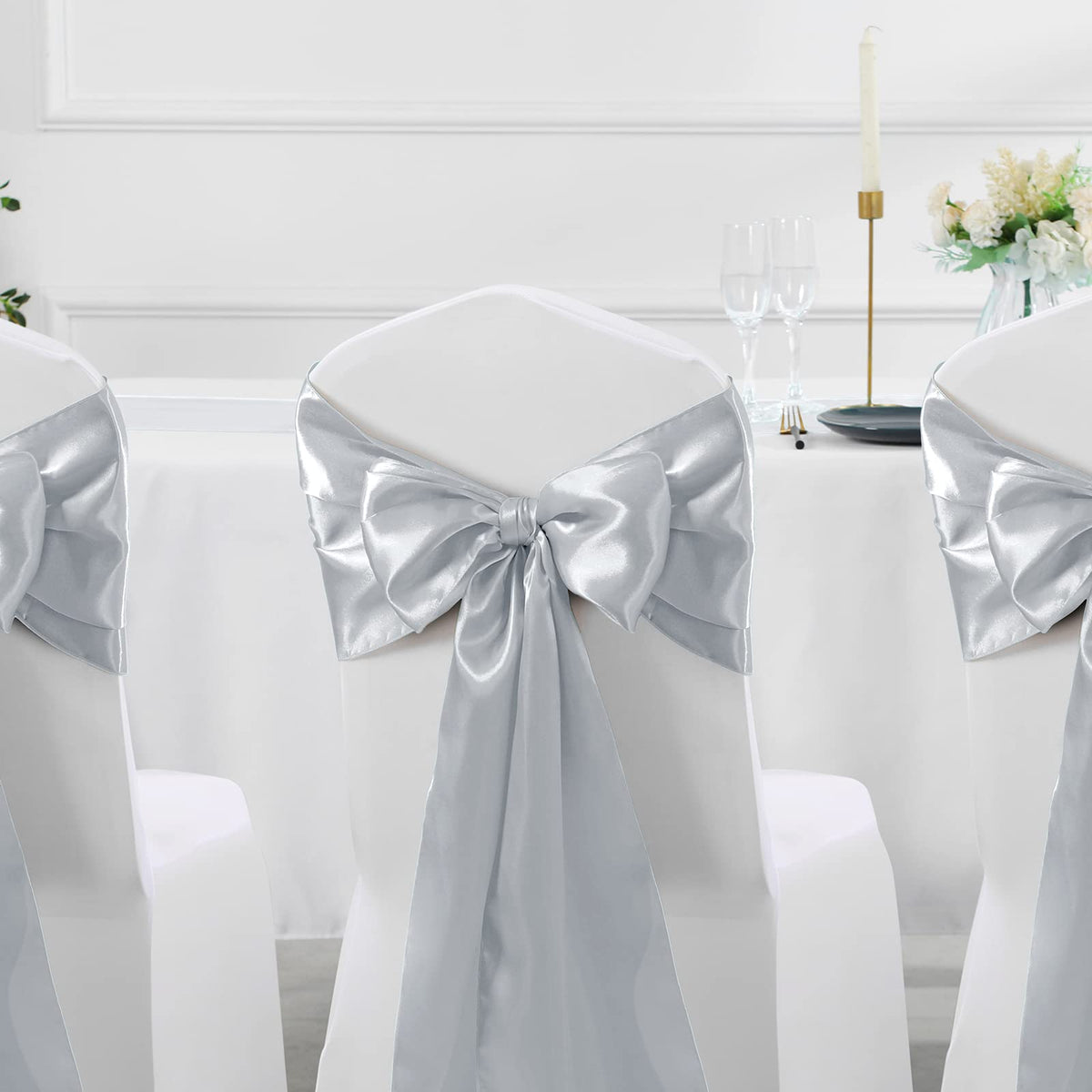 Manyshofu satin table runner tied on a chair back for decorative flair.