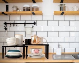 Marsui pots, lids, and pan storage keeps bulky cookware off the counter