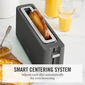 Martha Stewart 2-Slice Long Slot Toaster cool-touch panel signals safe operation.