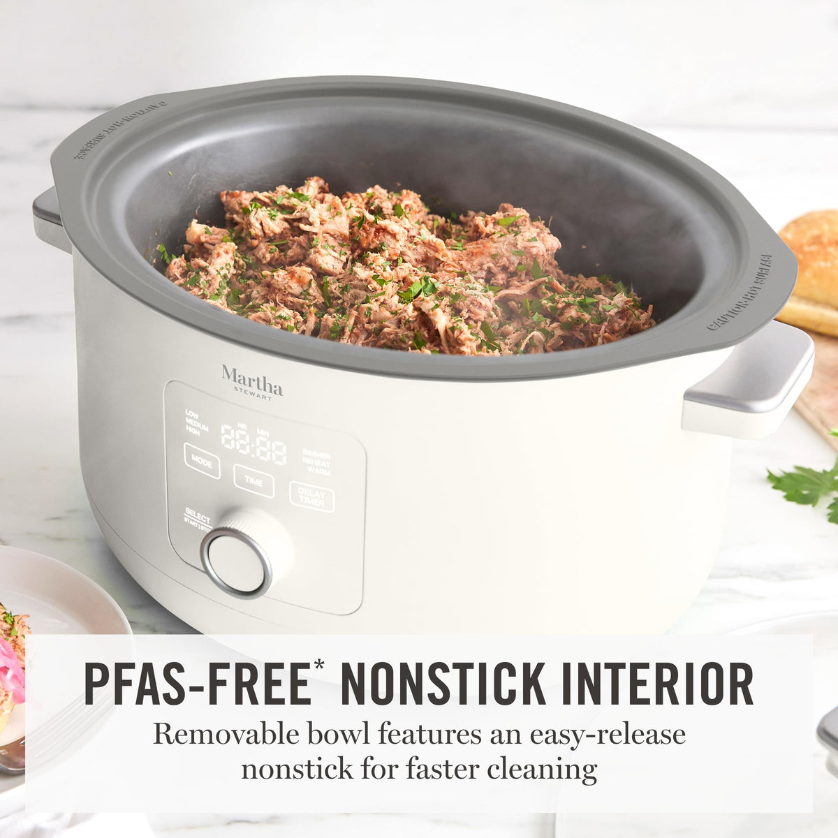 Martha Stewart 8-qt slow cooker with six modes display enables versatile cooking.