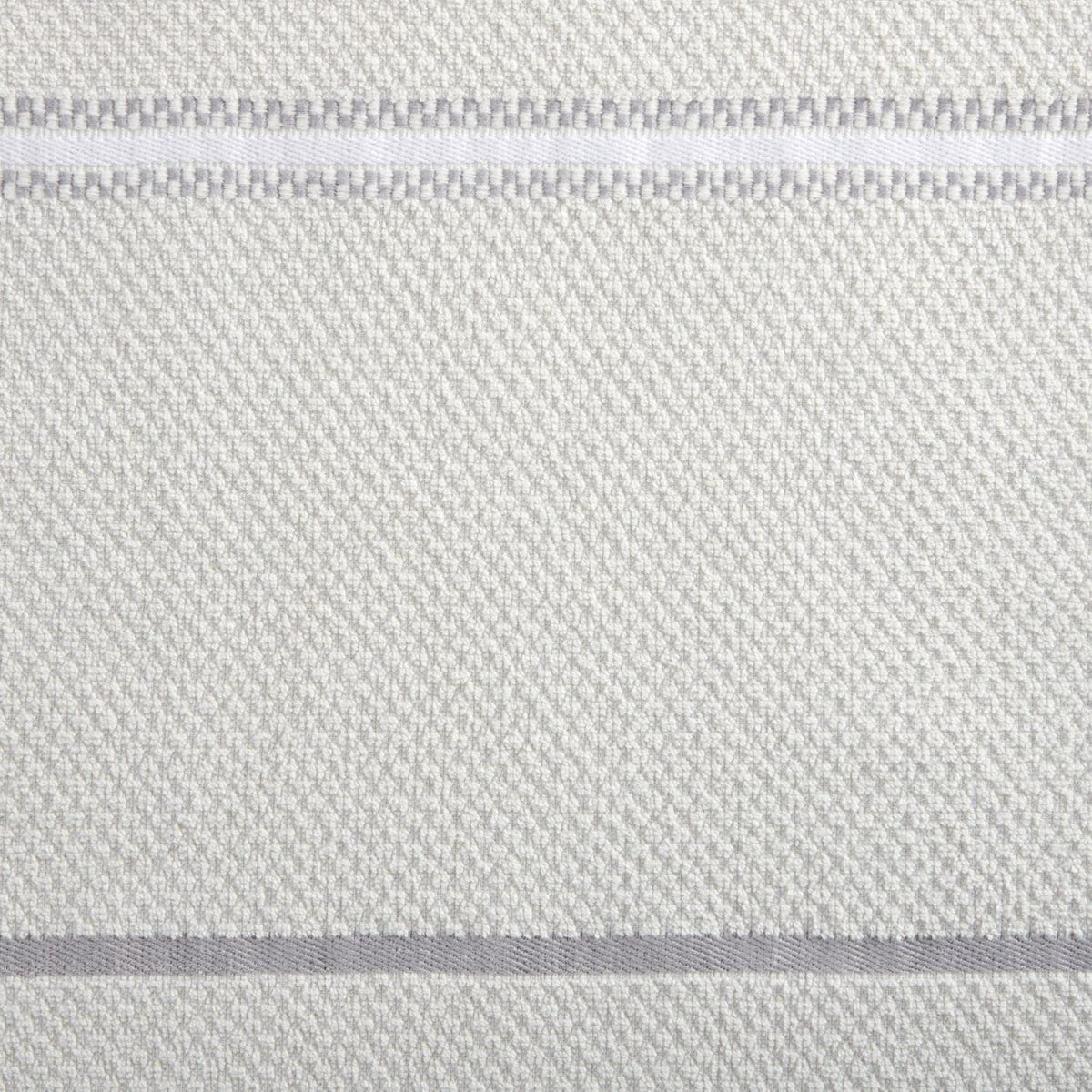 Two solid towels with stripe detail for cohesive kitchen decor.