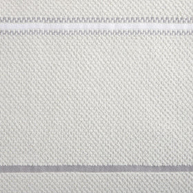 Two solid towels with stripe detail for cohesive kitchen decor.