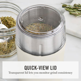 Transparent quick-view lid of Martha Stewart grinder monitors grind without stopping.