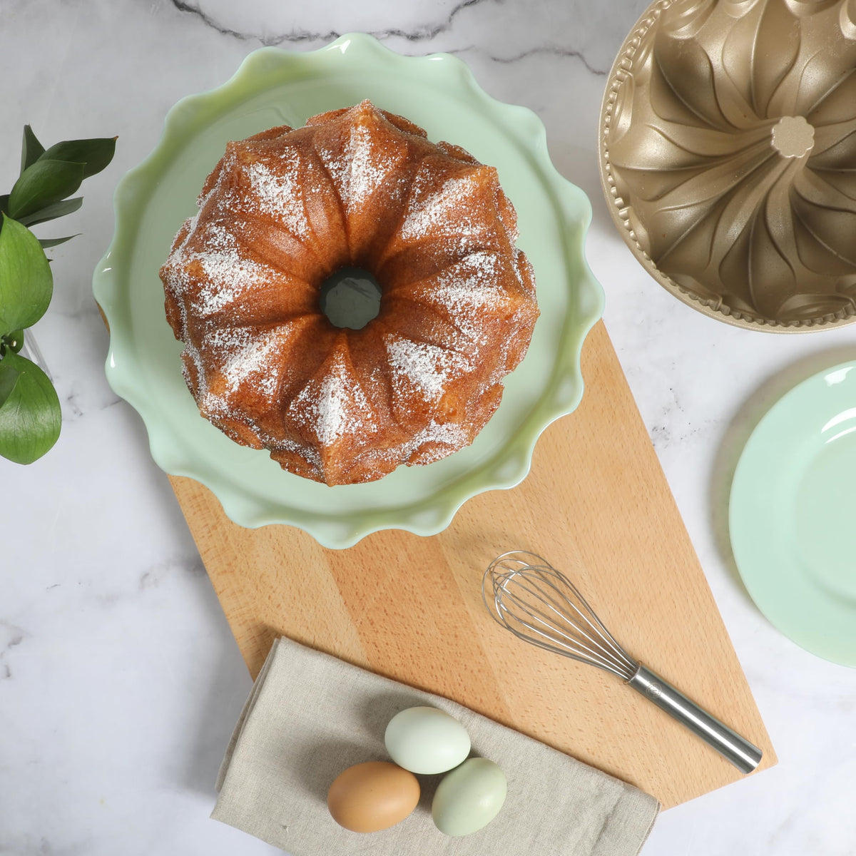 Martha Stewart Dunelle side view highlights champagne nonstick interior for easy cake release.