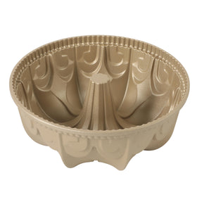 Martha Stewart Dunelle cake pan top view shows even heating for uniform baking and a graceful fluted silhouette.