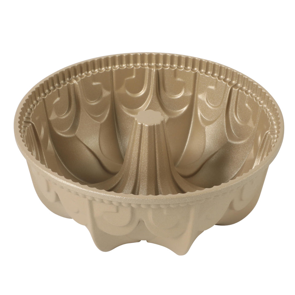 Martha Stewart Dunelle cake pan top view shows even heating for uniform baking and a graceful fluted silhouette.