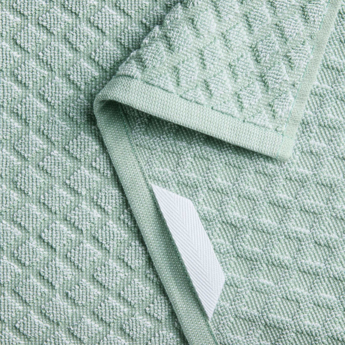 Martha Stewart Honeycomb Chambray towel with hanging loop, ideal for drying.
