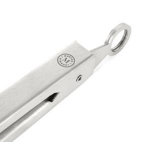 Martha Stewart Richburn tongs with pull-tab lock for compact storage.
