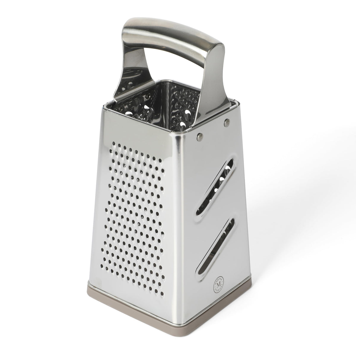 Martha Stewart Sprucedale grater on counter with integrated collection area catching grated food