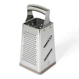 Martha Stewart Sprucedale grater on counter with integrated collection area catching grated food