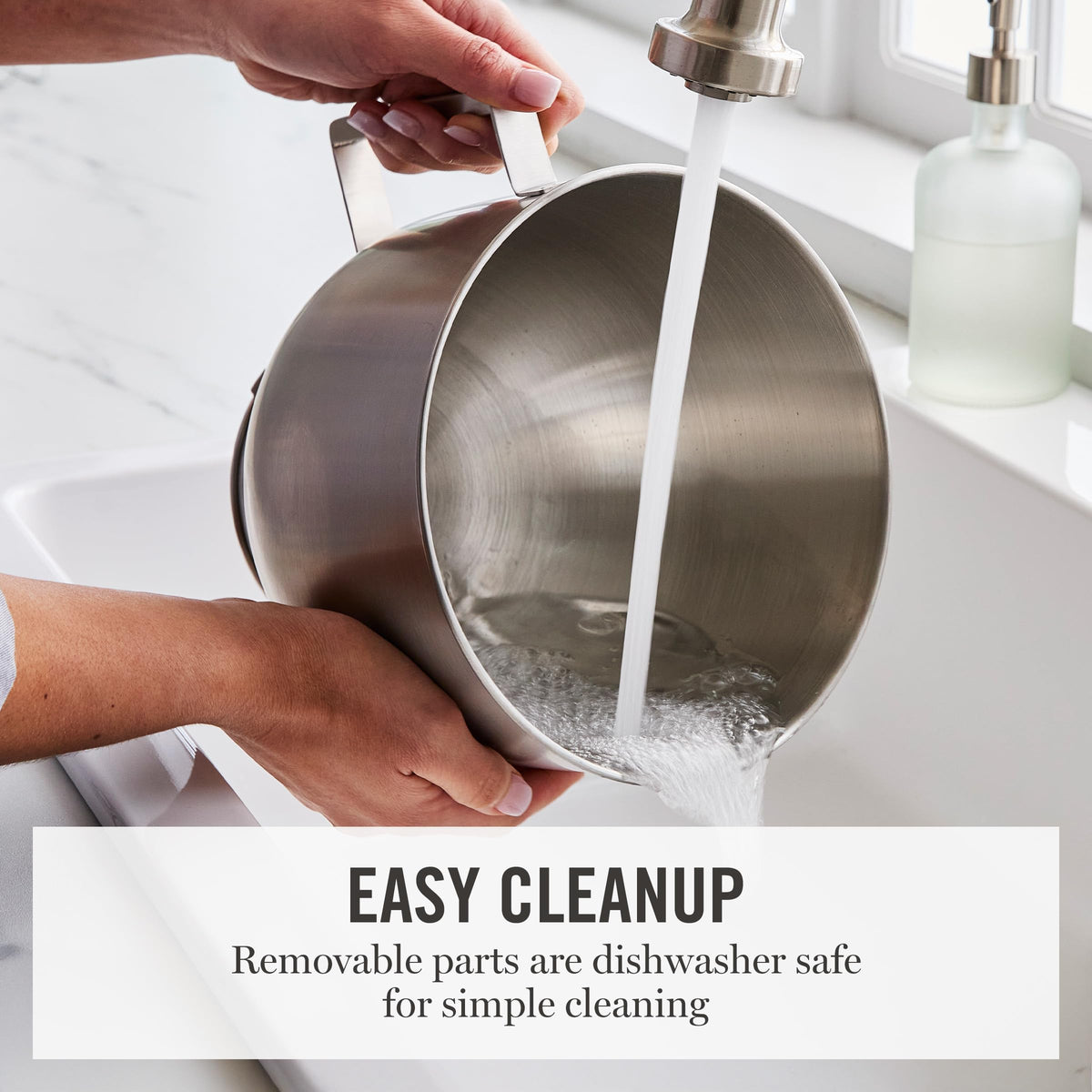 Removable splash shield with pour chute on the Martha Stewart mixer to reduce splatter.