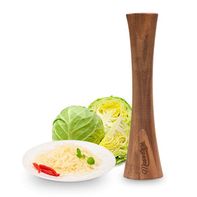 Masontops Pickle Packer acacia wood tamper for efficient kraut crushing and brine formation.