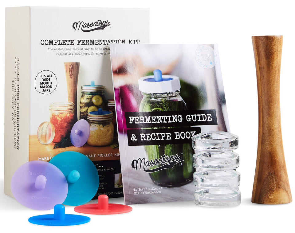 Masontops Pickle Pipe lids on wide-mouth jars enabling easy fermentation.