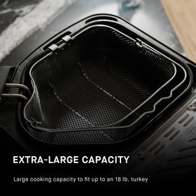 Masterbuilt cooking basket with lifting hook for safe handling.