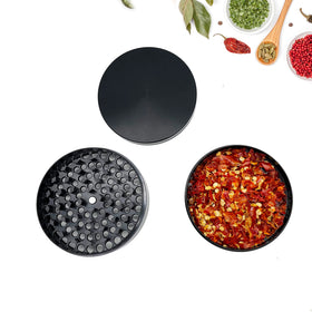 Matoolser compact spice grinder held in hand, ideal for kitchen prep.
