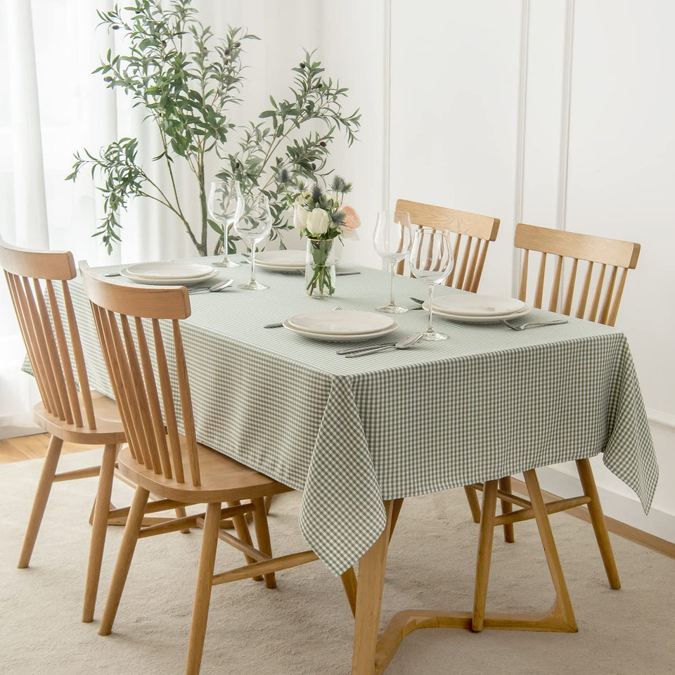 Maxmill checkered rectangle tablecloth in sage white showing water resistance for spills