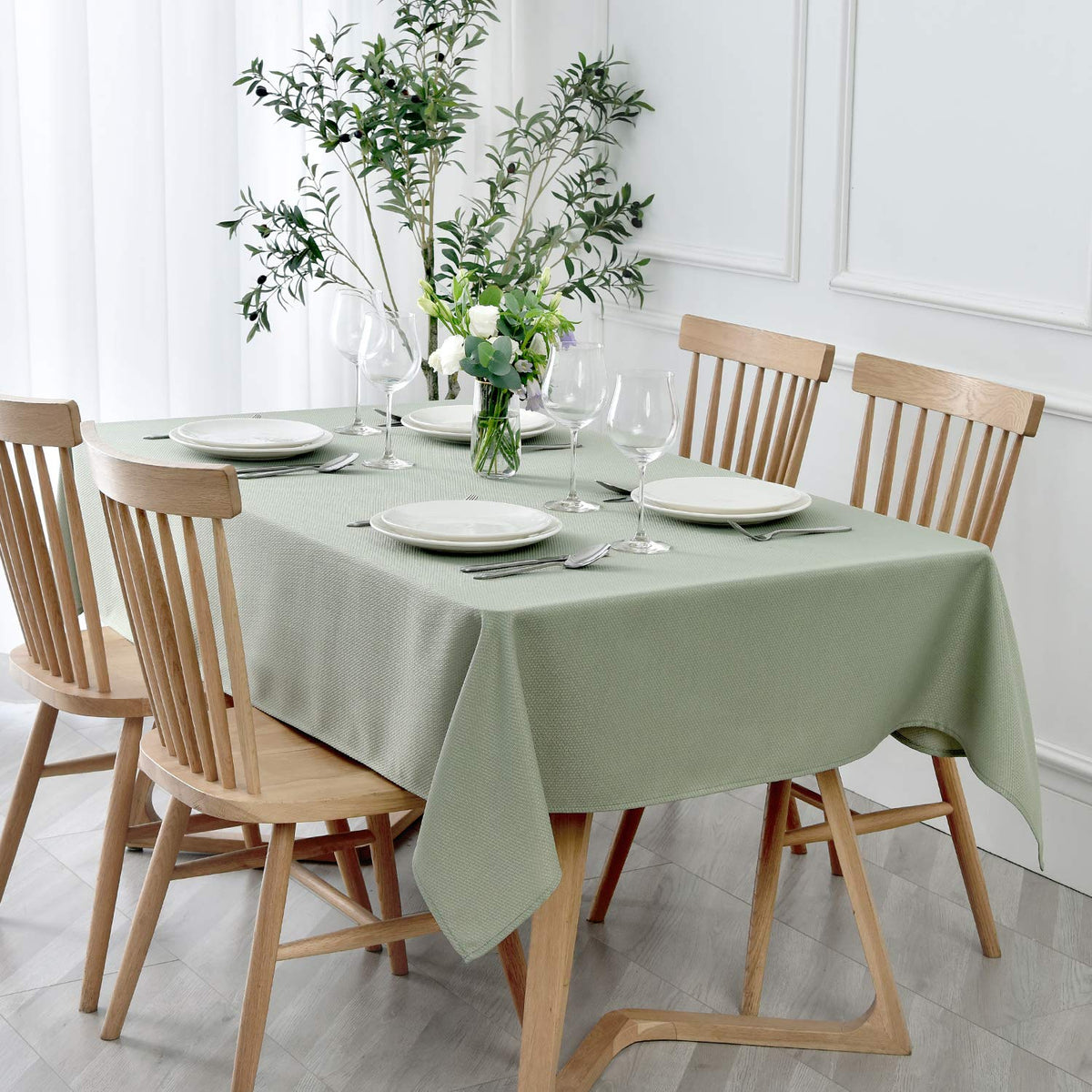 Maxmill rectangle textured tablecloth in sage green for elegant indoor dining.